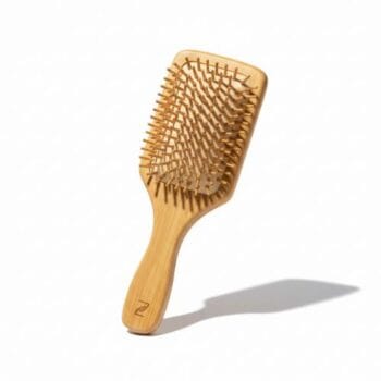 Premium wooden hair brush with rounded bristles for scalp massage and anti-hair fall care.